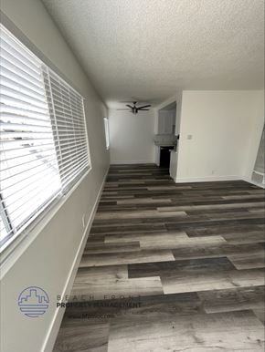 Hawthorne apartment for rent - an empty room with a large window and a ceiling fan